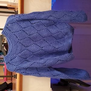 Vibrant blue sweater with eyelets in a diamond pattern